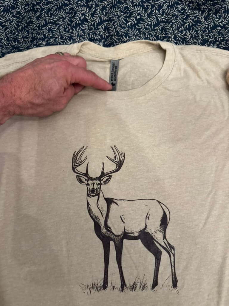 Heather cream tee with standing whitetail buck print
