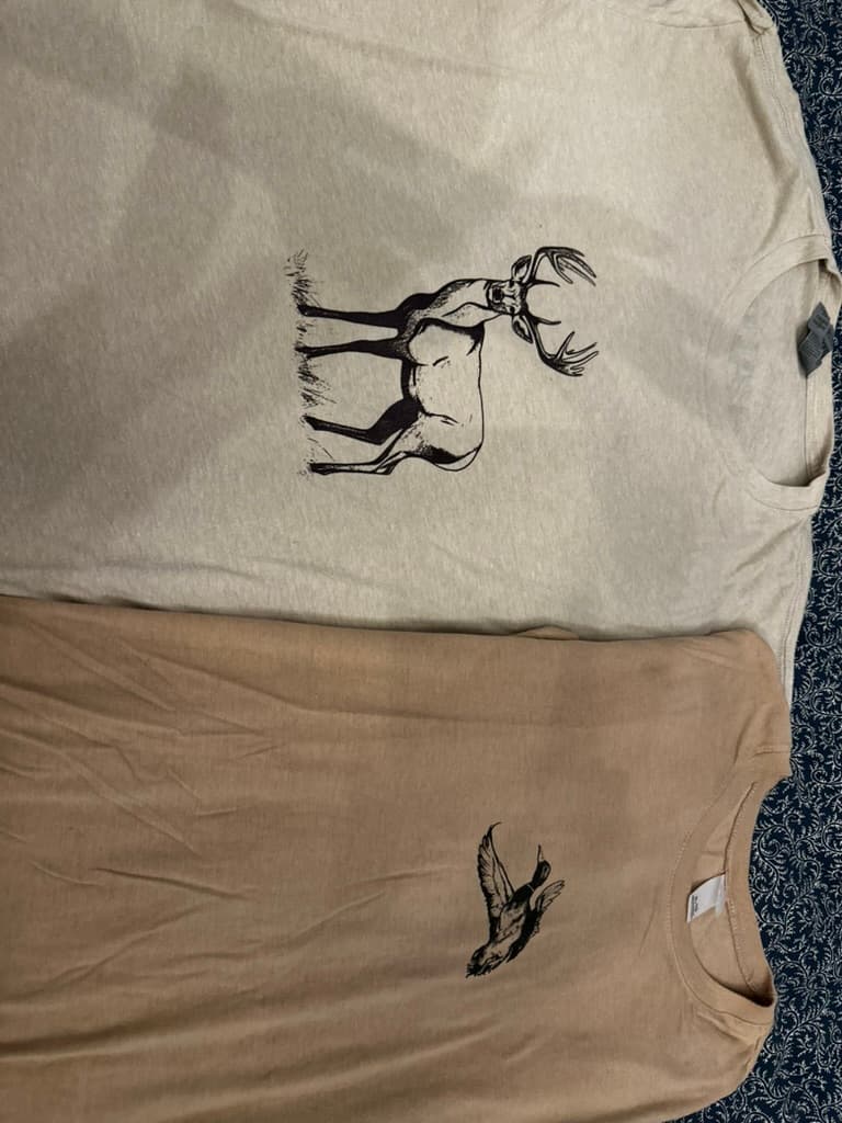 Two tees stacked, buck and mallard prints