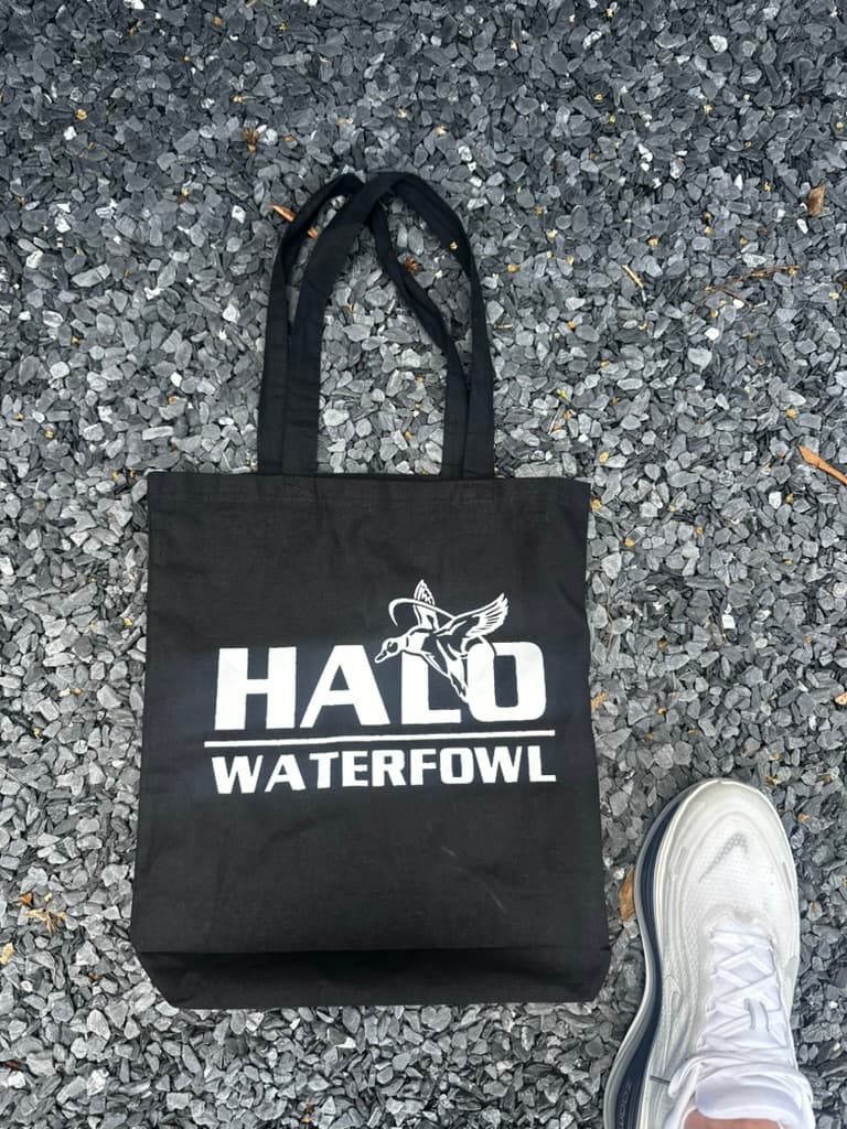 Black canvas tote with white logo print